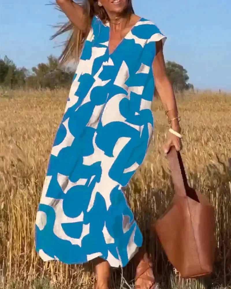 Maxi dress for women with V-neck and flowing patterns
