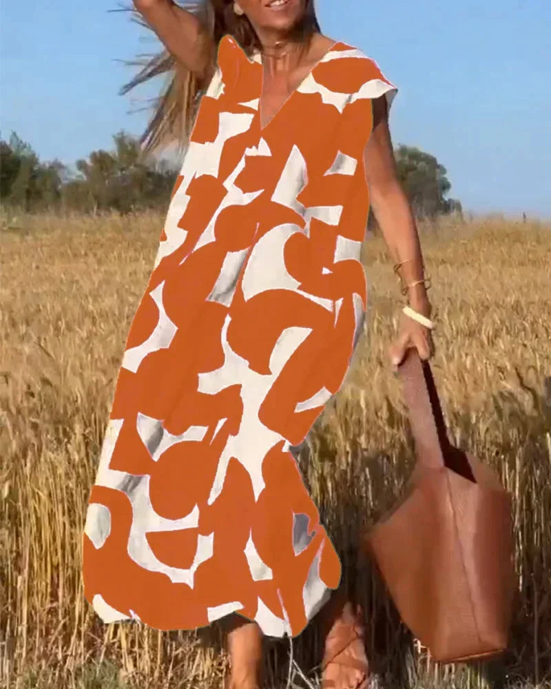 Maxi dress for women with V-neck and flowing patterns