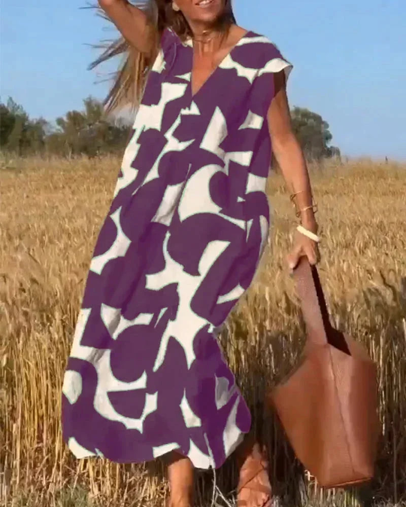 Maxi dress for women with V-neck and flowing patterns
